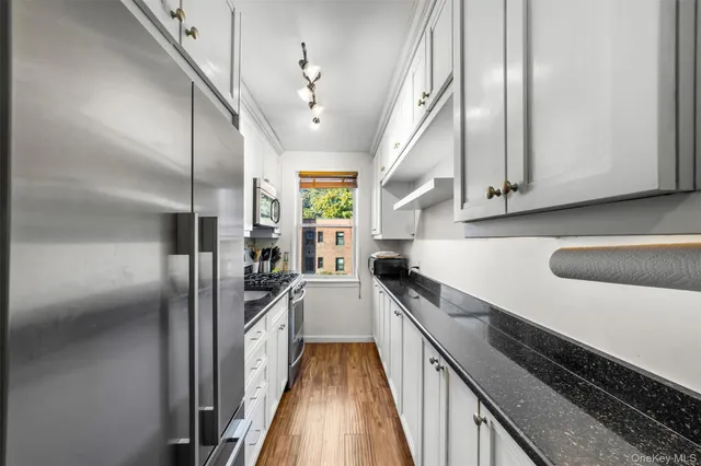 a kitchen with a sink and refrigerator