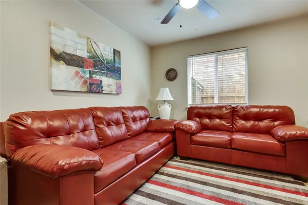 an aerial view of residential houses with outdoor space and ocean view