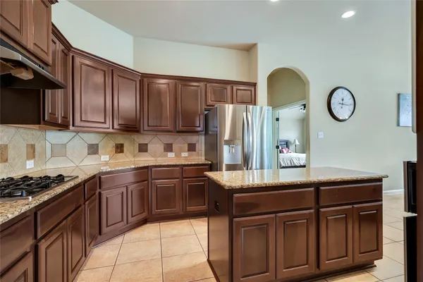 an aerial view of a house with outdoor space