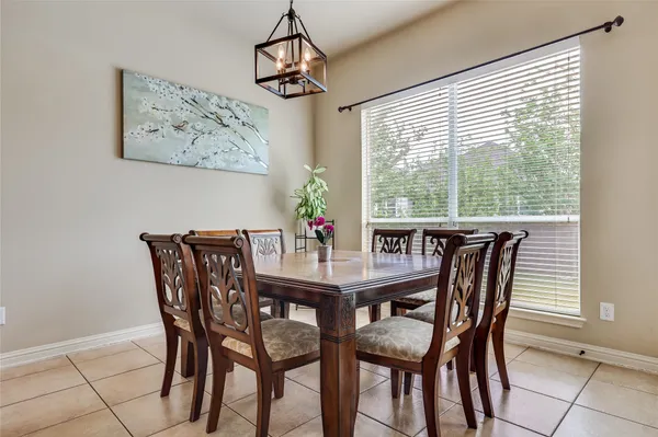 an aerial view of residential houses with outdoor space and swimming pool