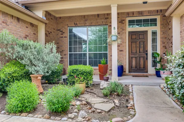 a bathroom with a tub shower and sink