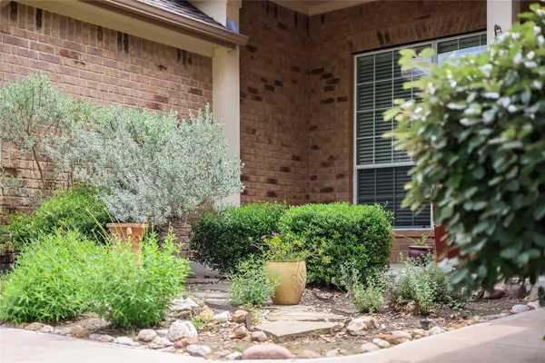 a bathroom with a toilet a sink and a large mirror