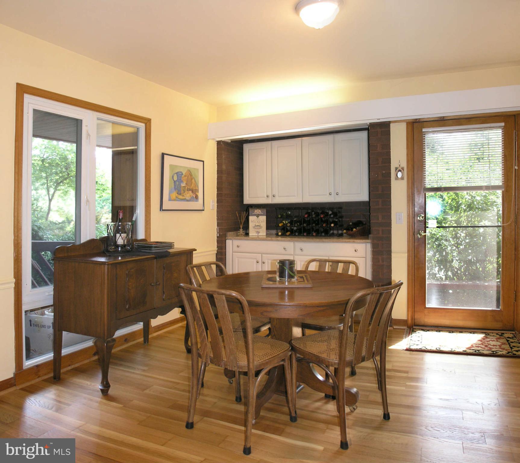 11431 Hook Road Reston, VA 20190 - Photo 11 of 30 a view of a dining room with furniture and wooden floor