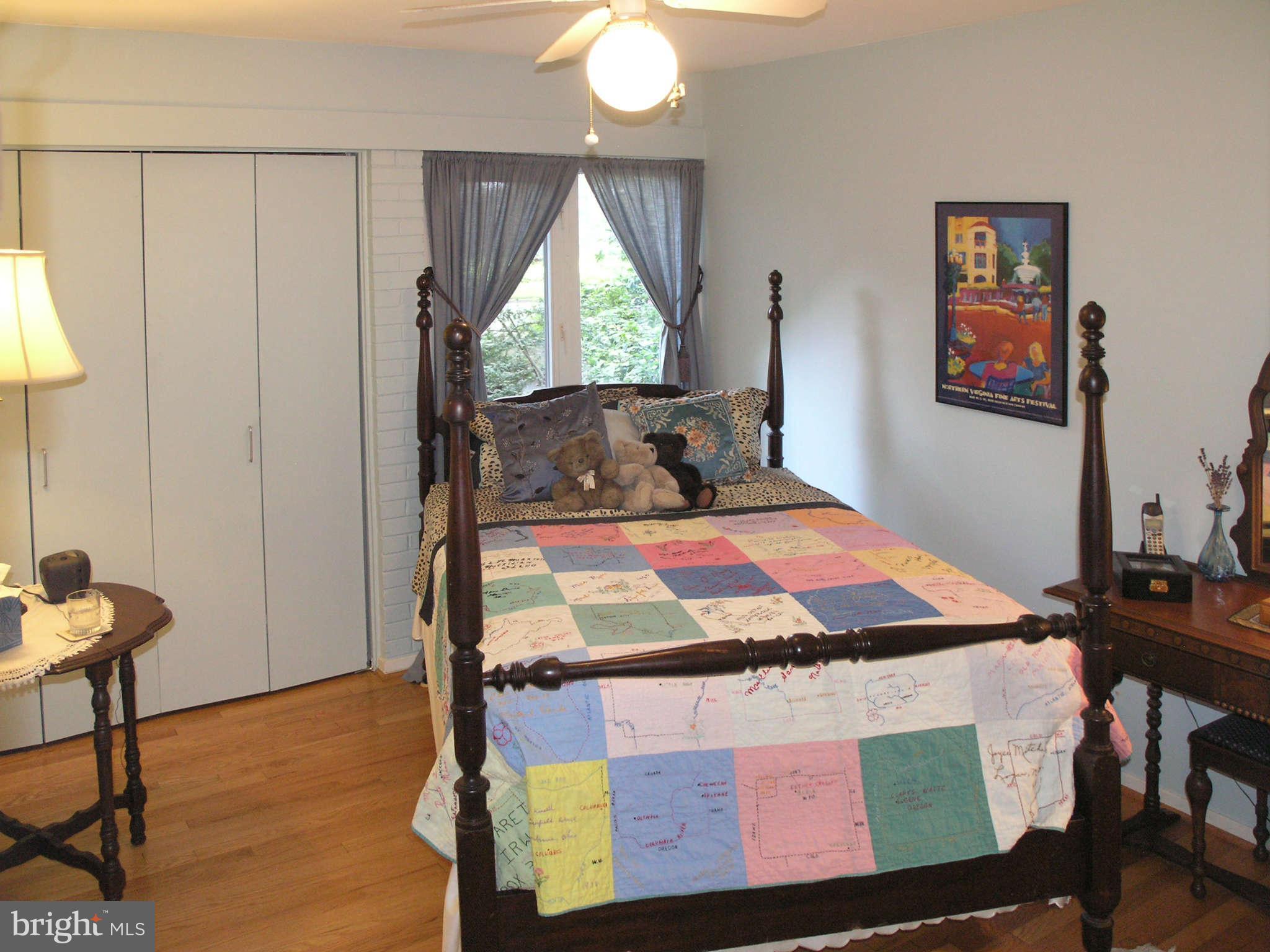 11431 Hook Road Reston, VA 20190 - Photo 20 of 30 a bedroom with a bed and a window
