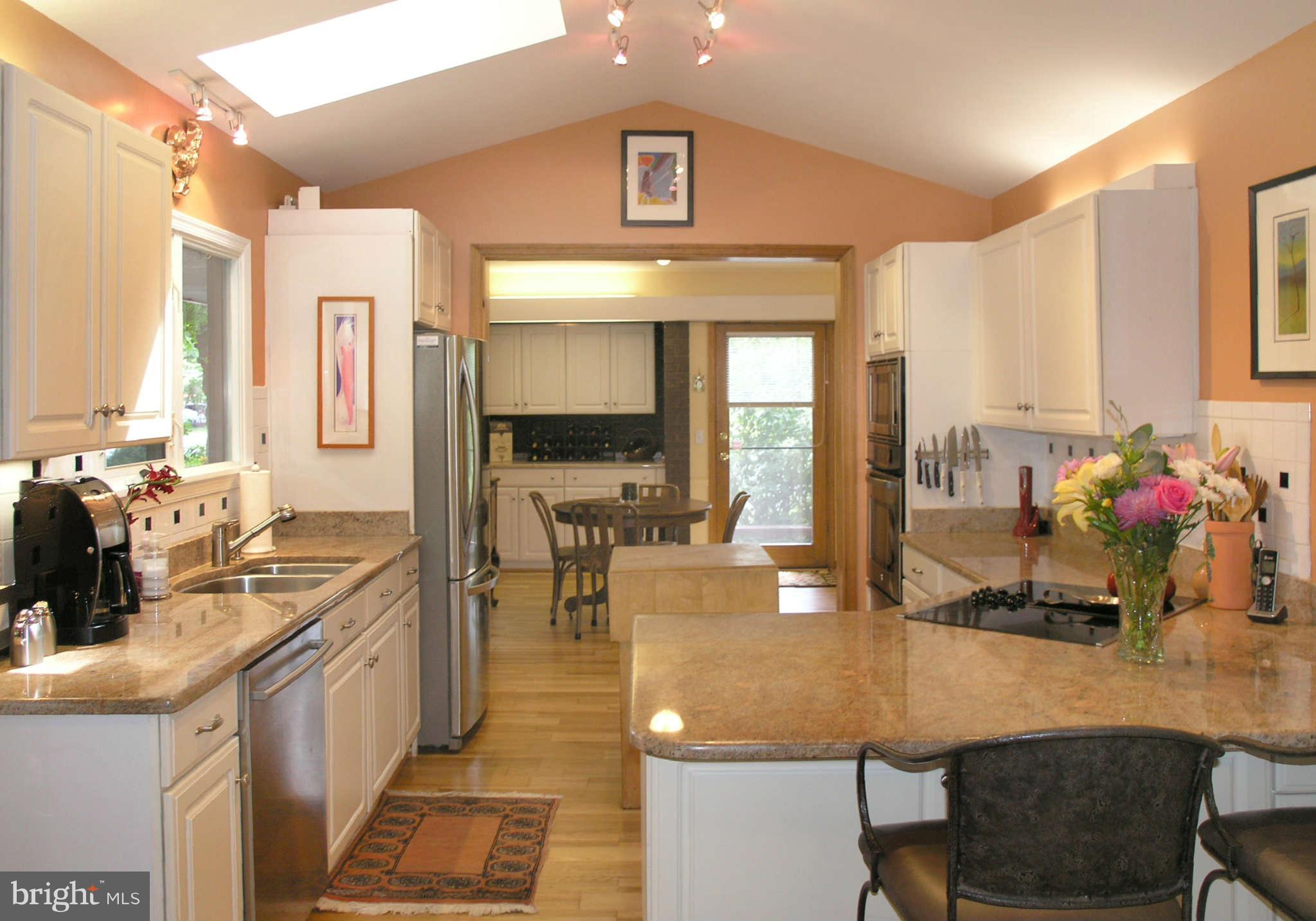 11431 Hook Road Reston, VA 20190 - Photo 10 of 30 a kitchen with a sink appliances and cabinets