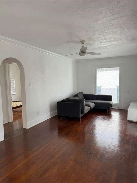 817 Tyler Street, Unit 8 Hollywood, FL 33019 - Photo 6 of 14 a living room with furniture and a wooden floor