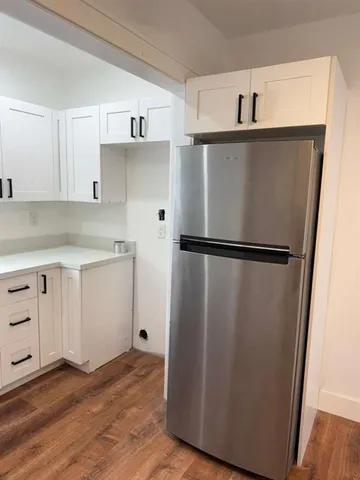 a kitchen with appliances and cabinets