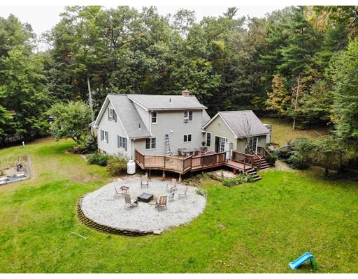 40 Leno Road Holland, MA 01521 - Photo 3 of 26 a aerial view of a house with swimming pool and big yard