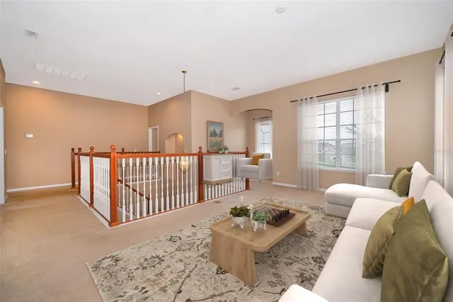 a bedroom with furniture and wooden floor