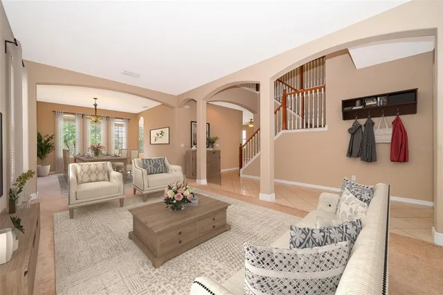 a living room with furniture and a table