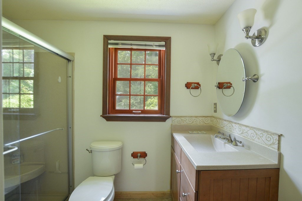 41 Braeside Road Falmouth, MA 02540 - Photo 11 of 24 a bathroom with a sink toilet and window