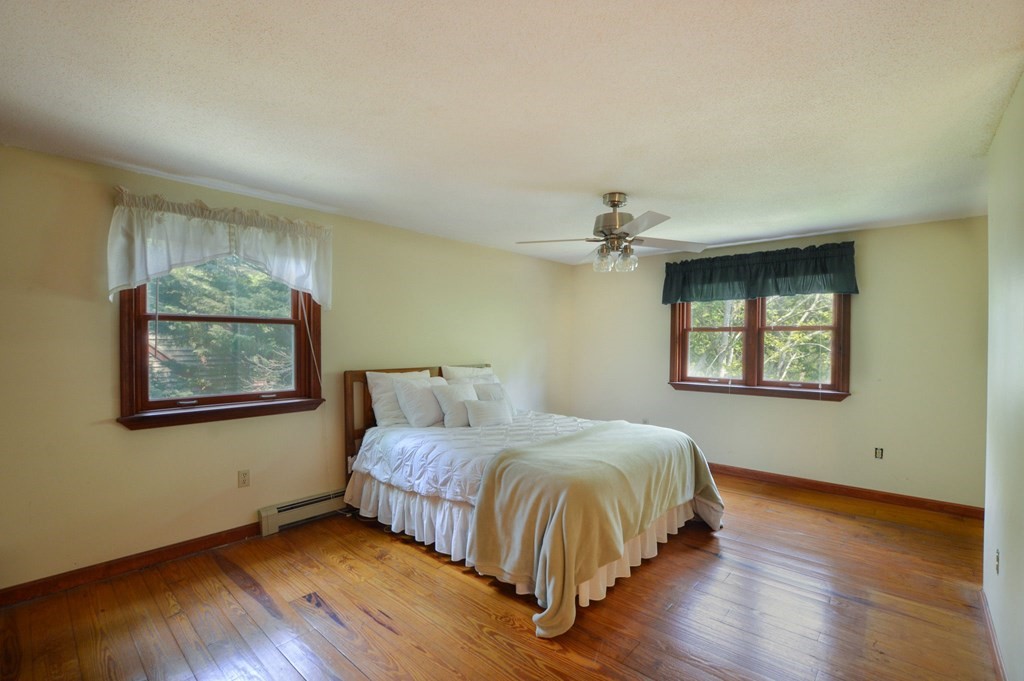 41 Braeside Road Falmouth, MA 02540 - Photo 16 of 24 a bedroom with a bed and a window