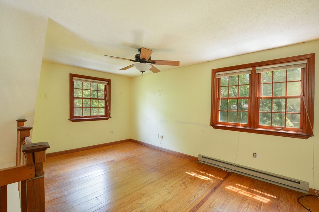 41 Braeside Road Falmouth, MA 02540 - Photo 19 of 24 a view of an empty room with a window and wooden floor