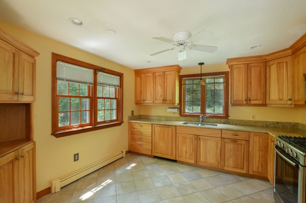 41 Braeside Road Falmouth, MA 02540 - Photo 7 of 24 a view of a kitchen counter top space cabinets and stainless steel appliances