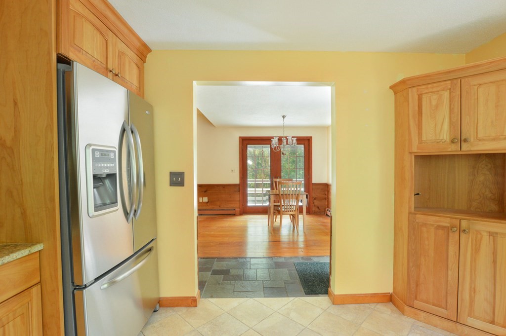 41 Braeside Road Falmouth, MA 02540 - Photo 8 of 24 a view of a hallway with wooden floor and a cabinet