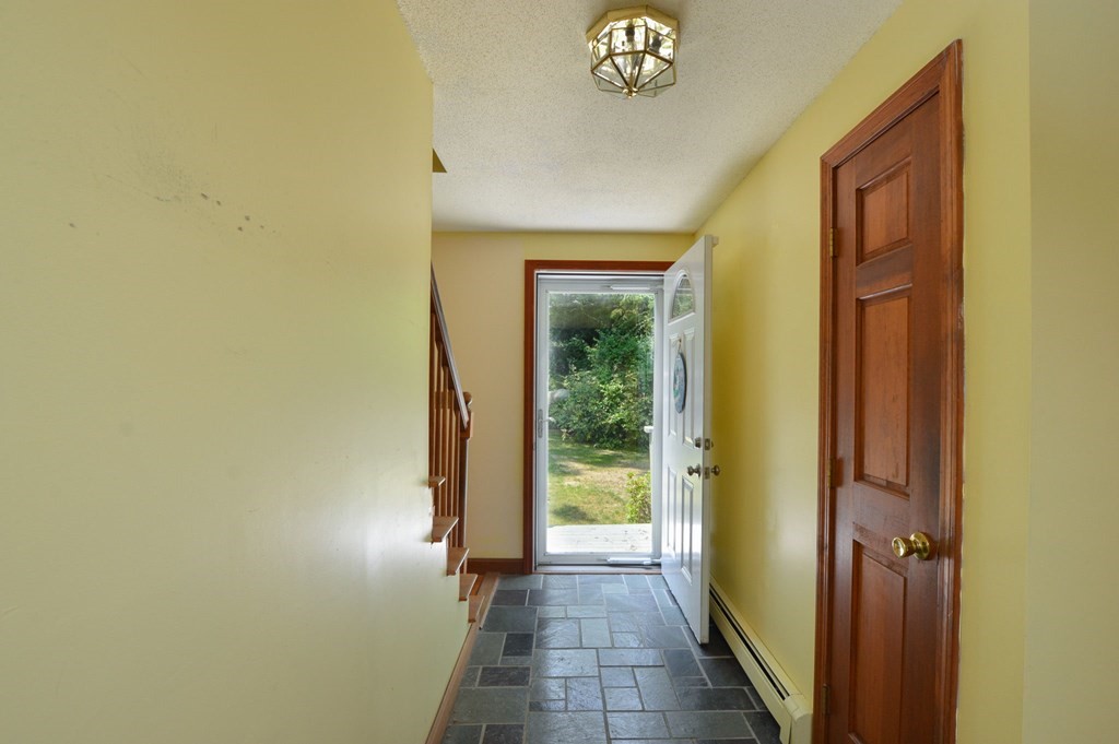 41 Braeside Road Falmouth, MA 02540 - Photo 10 of 24 a view of a hallway with wooden shelves