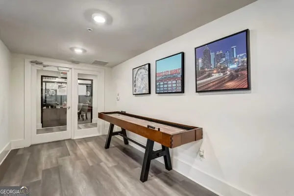 a view of a livingroom with furniture and workspace