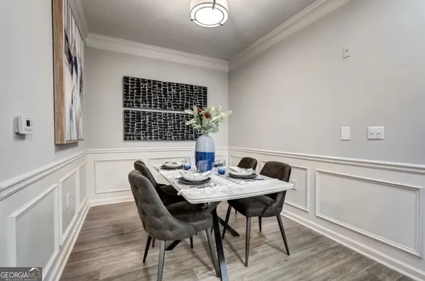 a view of a dining room with furniture window and wooden floor