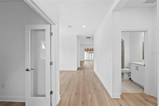 a view of a bathroom from the hallway