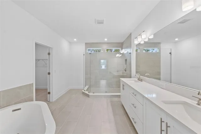 a bathroom with a bathtub and a shower
