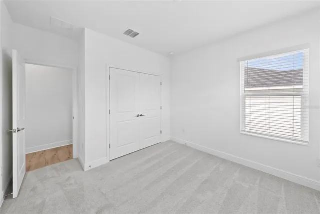 a bathroom with a double vanity sink a mirror and a bathtub
