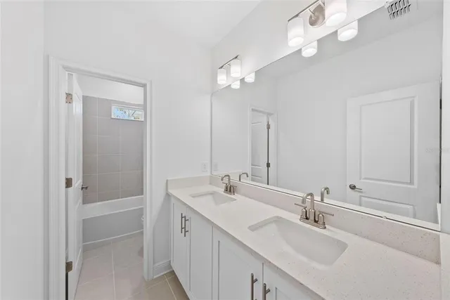 a bathroom with a bathtub and a toilet