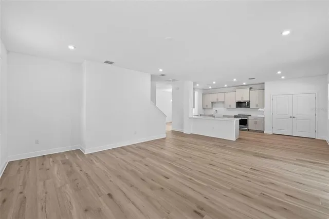 a view of kitchen with wooden floor