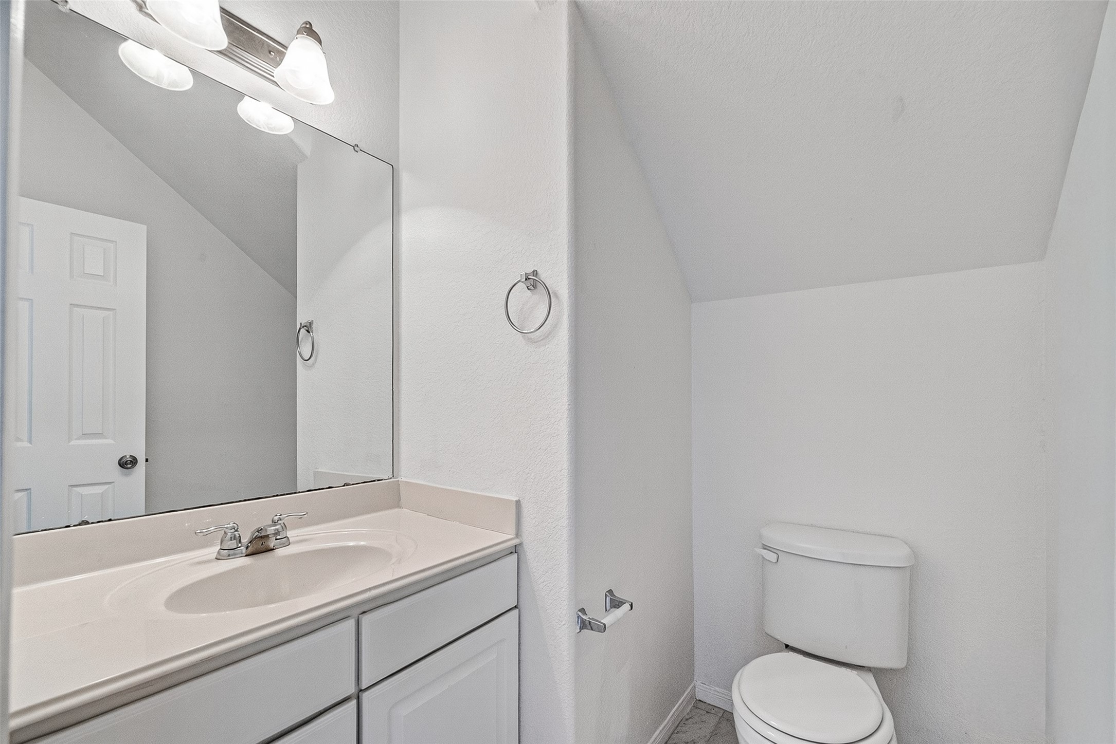 2702 Modano Court Fresno, TX 77545 - Photo 19 of 46 a bathroom with a granite countertop sink toilet and a mirror