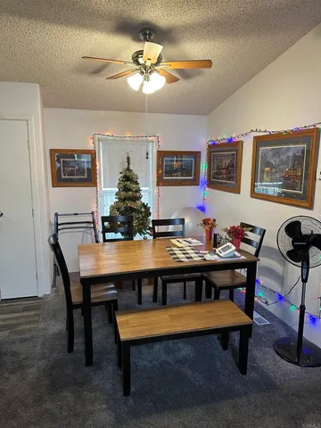 a view of a workspace with a table and chair in a room