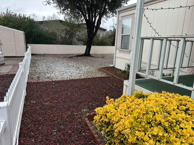 a view of a backyard of the house