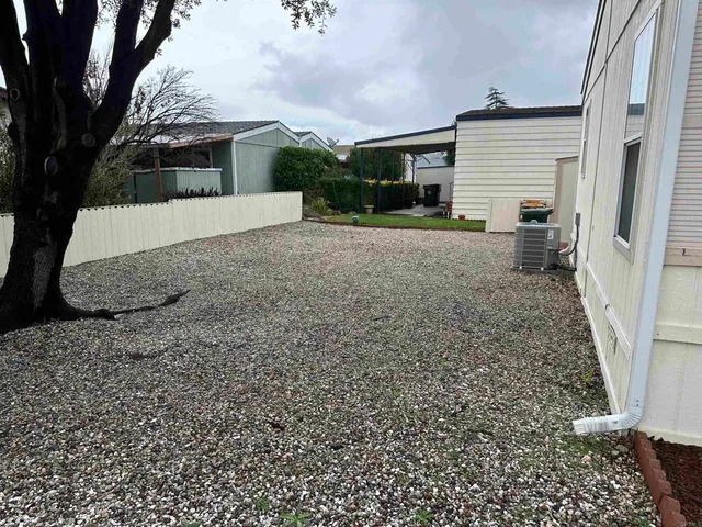a view of a house with a back yard