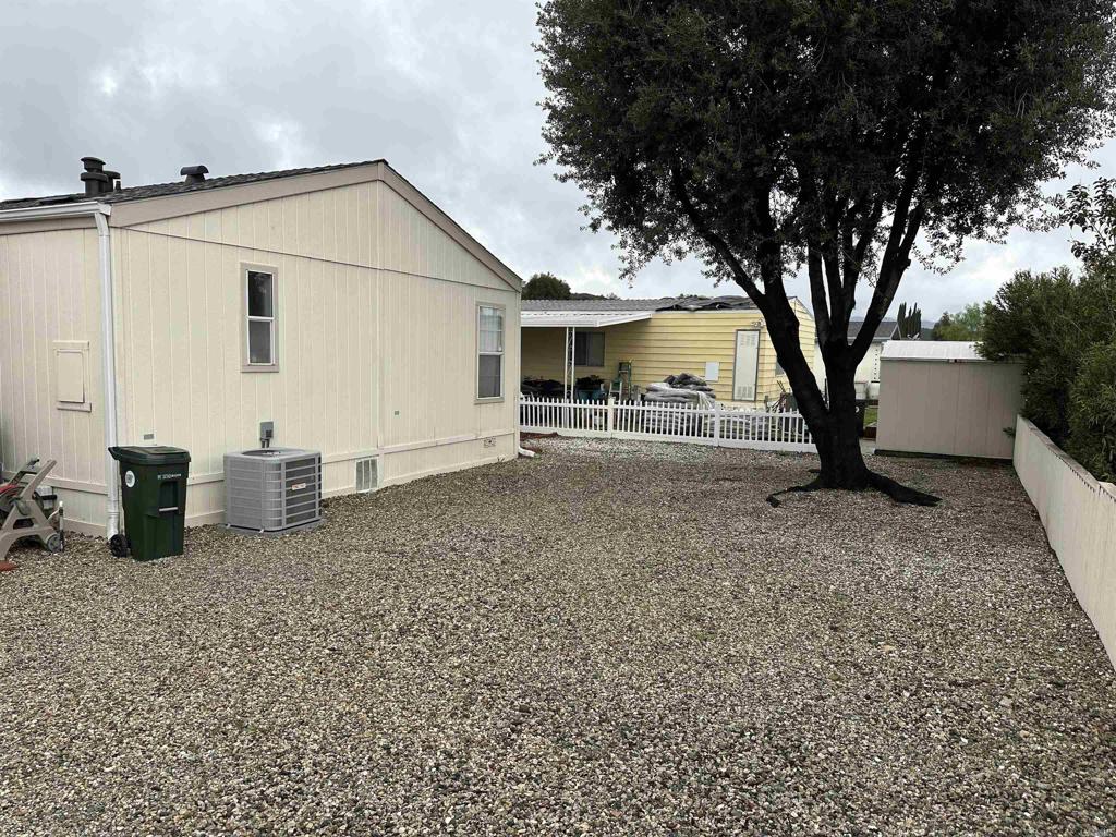 21423 Bramble Way Saugus, CA 91350 - Photo 6 of 29 a view of a house with backyard and a tree