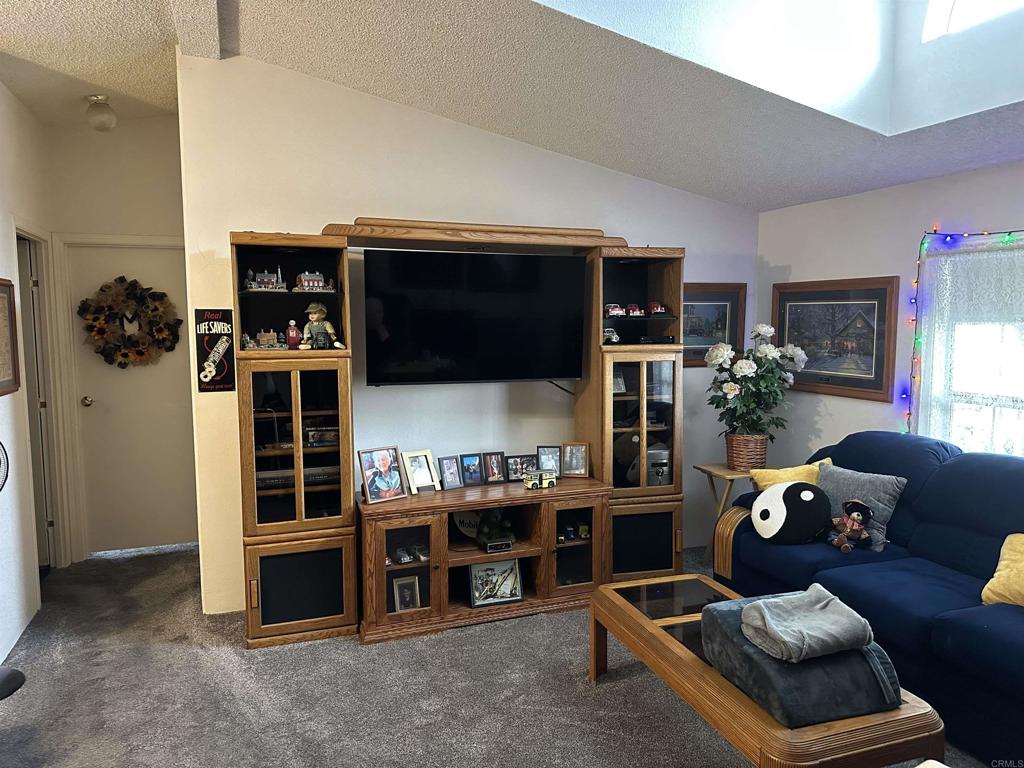 21423 Bramble Way Saugus, CA 91350 - Photo 7 of 29 a living room with furniture and a flat screen tv