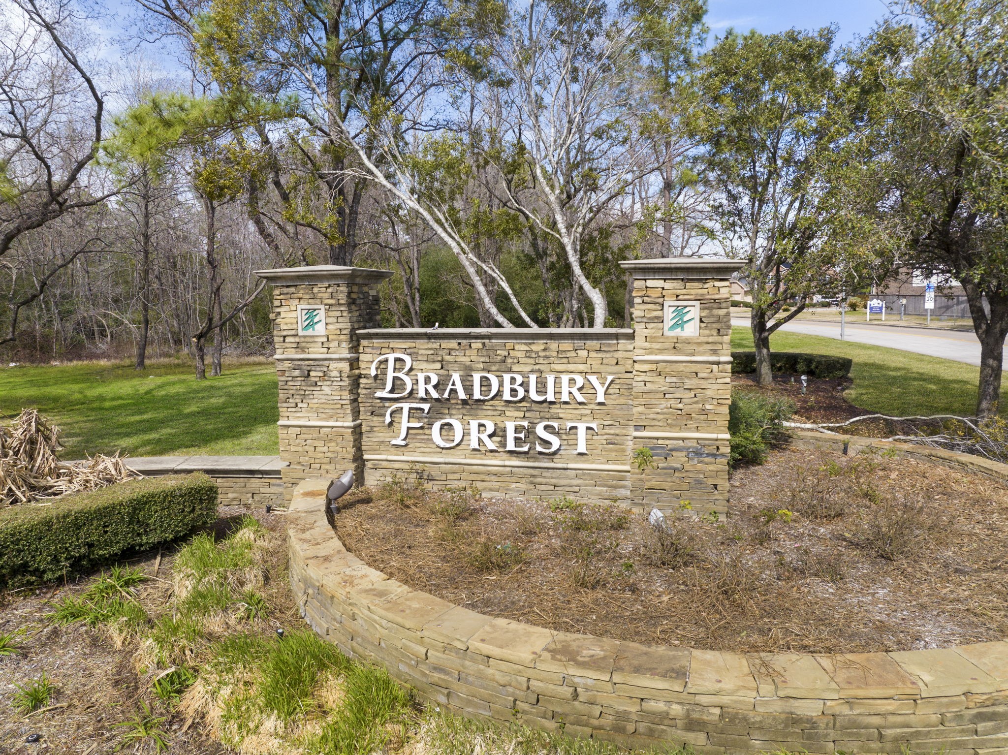 2819 Bradbury Hills Road Spring, TX 77373 - Photo 47 of 50 Welcome to Bradbury Forest, where a charming stone entrance greets you with lush greenery, setting the tone for a warm and inviting community.