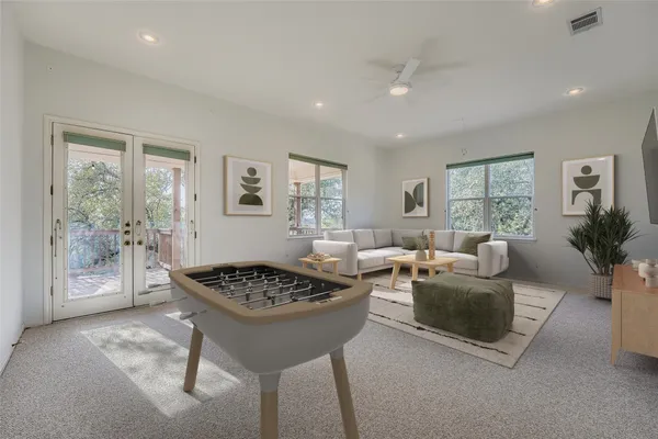a bathroom with a sink mirror and a shower