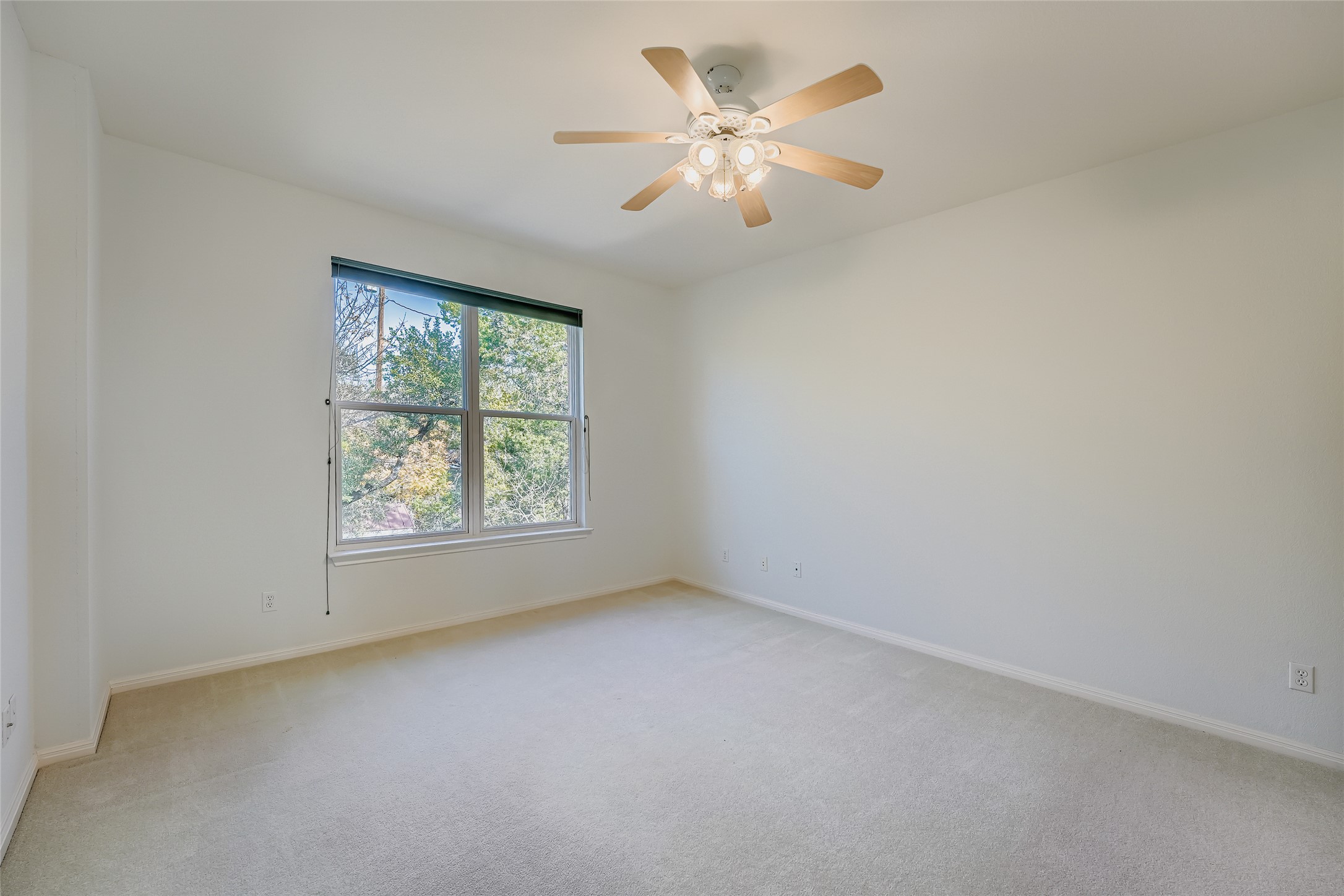8204 Texas Plume Road Austin, TX 78759 - Photo 25 of 40 Unfurnished room featuring light carpet and ceiling fan