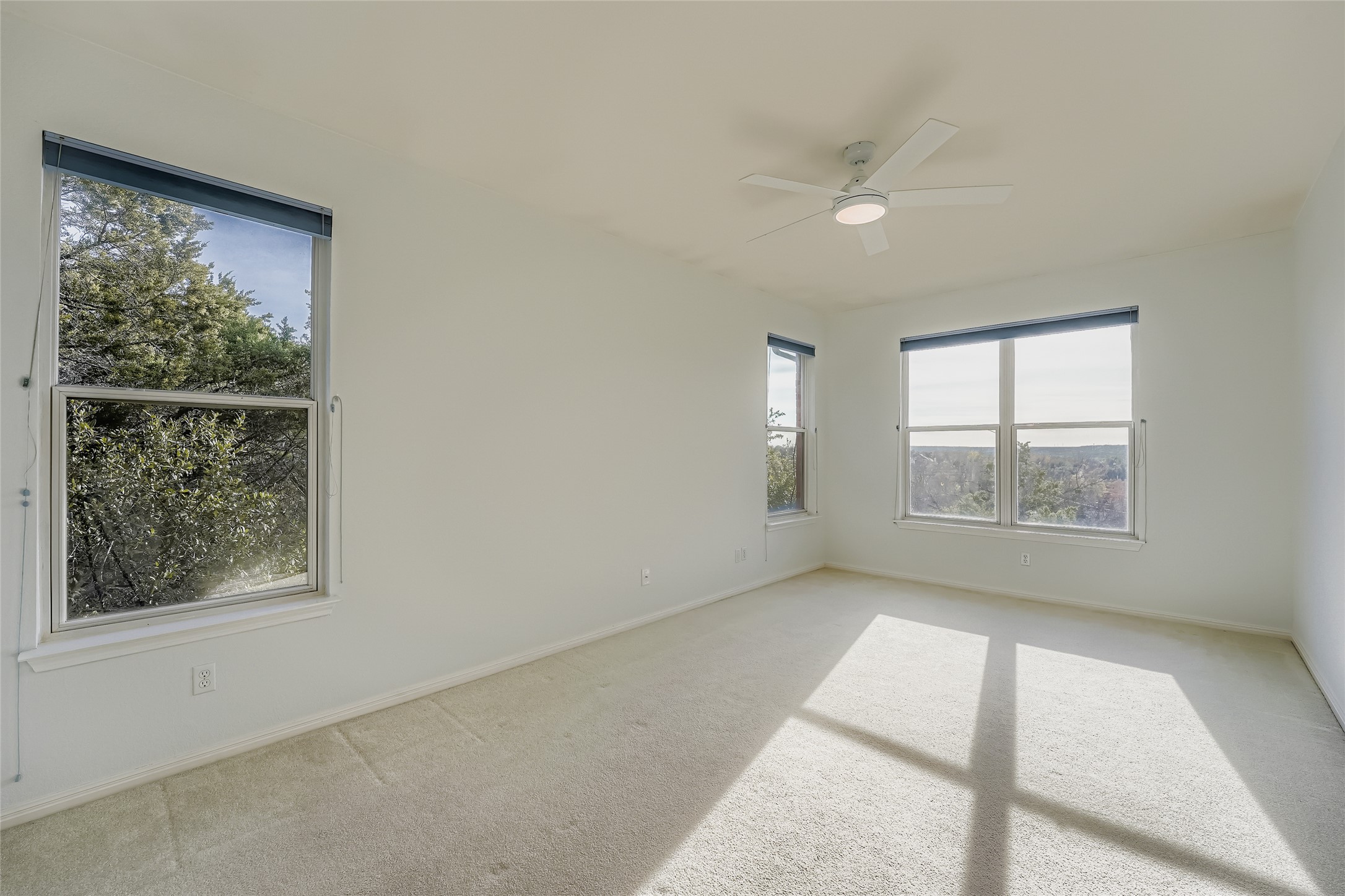 8204 Texas Plume Road Austin, TX 78759 - Photo 27 of 40 Spare room featuring carpet floors and ceiling fan