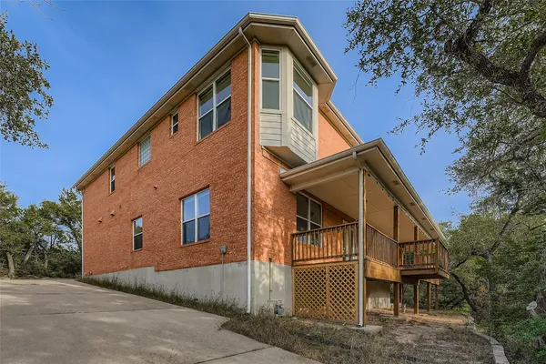 an aerial view of a house with a yard and outdoor seating
