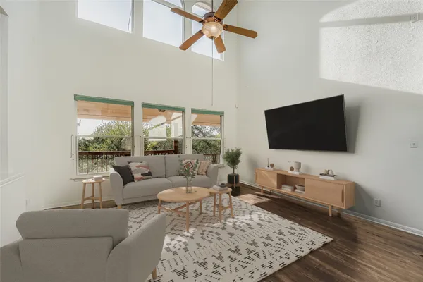 a living room with fireplace furniture and a flat screen tv