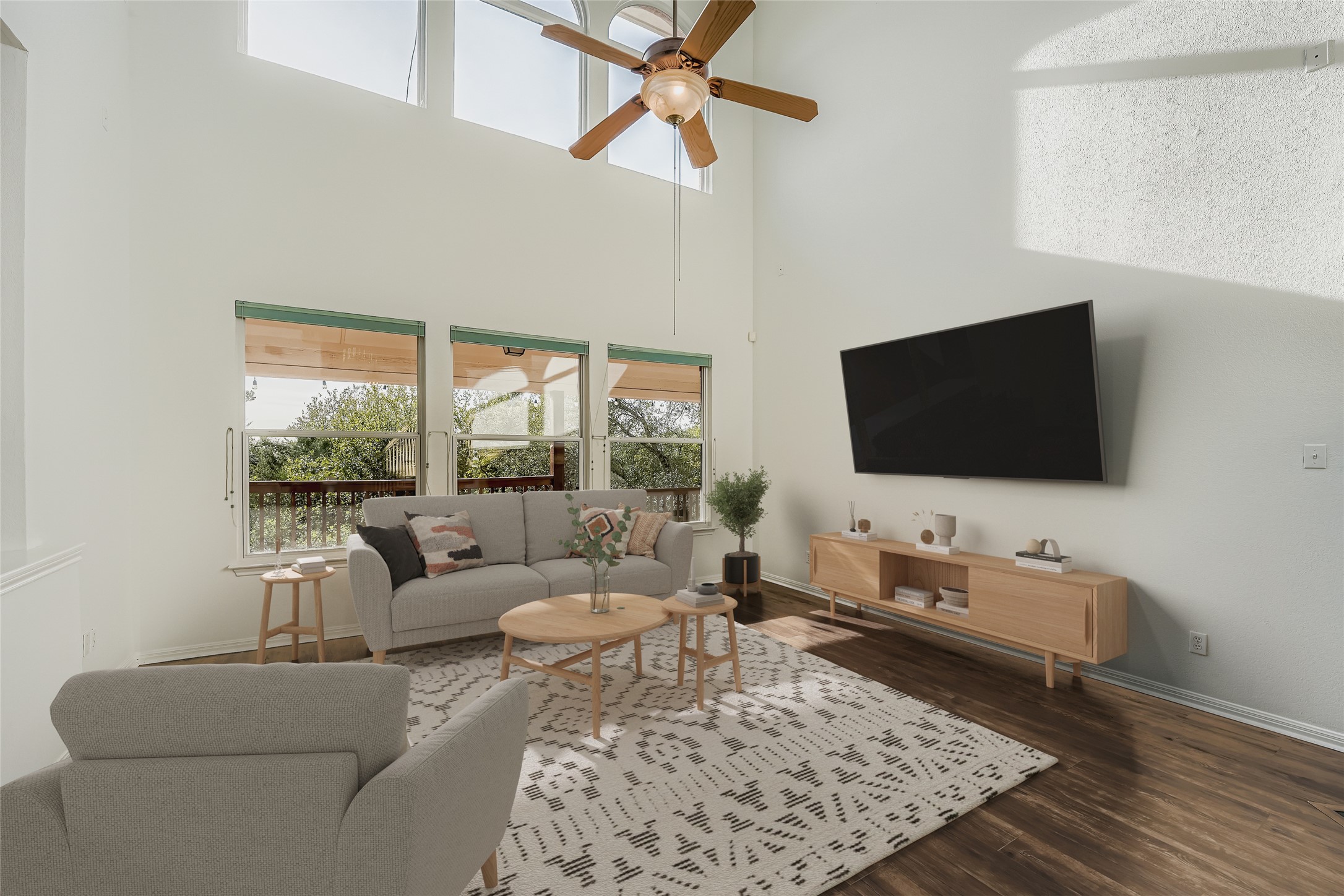 8204 Texas Plume Road Austin, TX 78759 - Photo 5 of 40 Living area with dark wood-style floors, ceiling fan, and a high ceiling