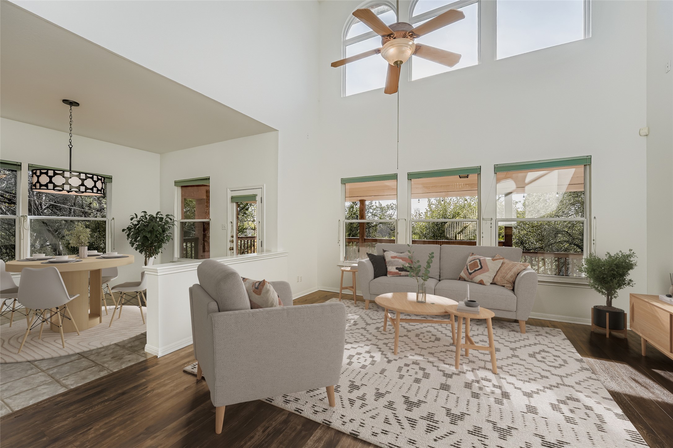 8204 Texas Plume Road Austin, TX 78759 - Photo 8 of 40 Living area featuring healthy amount of natural light, dark wood-style floors, ceiling fan, and a high ceiling