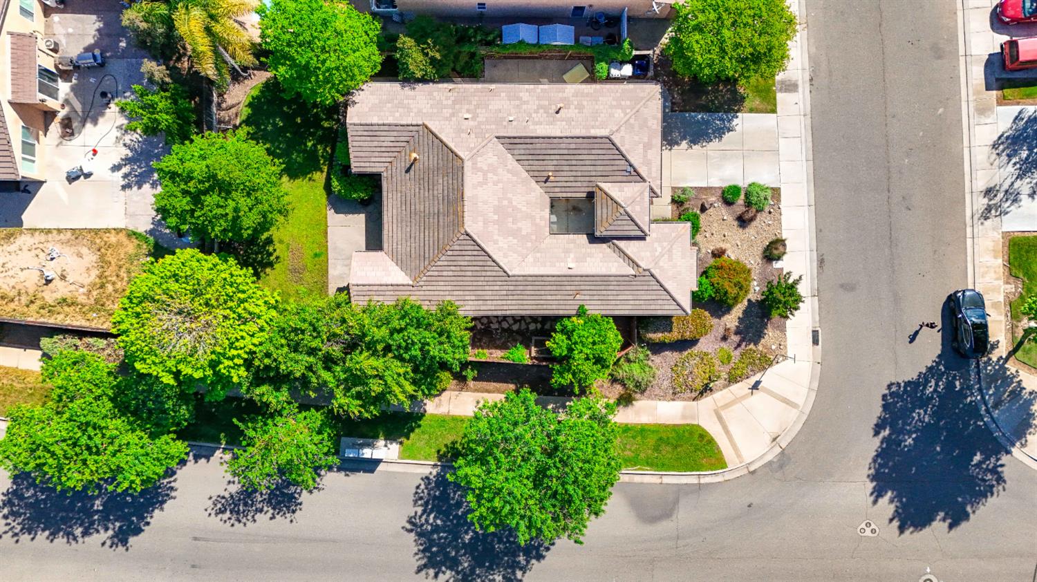 1427 Caraway Court Merced, CA 95340 - Photo 54 of 58 an aerial view of a house with a yard and garden