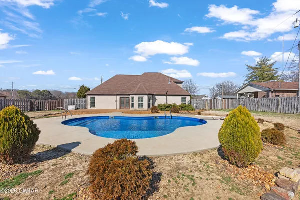 a view of a swimming pool with a lounge chair