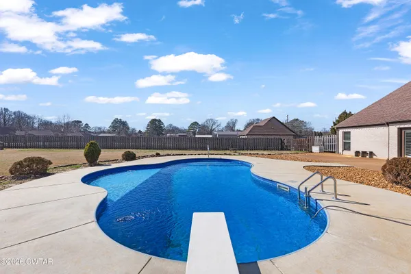 a view of a swimming pool with a lounge chair