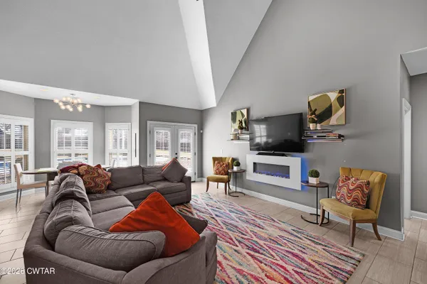 a living room with furniture and a rug