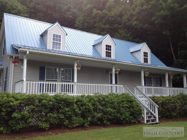 304 Green Knob Mountain Road Boone, NC 28607 - Photo 13 of 32 a front view of a house with a yard