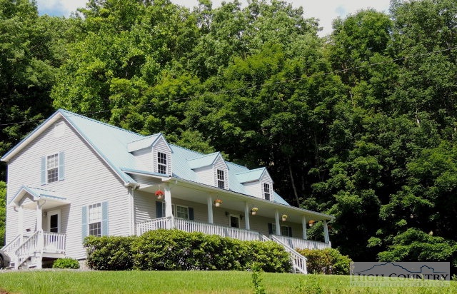 304 Green Knob Mountain Road Boone, NC 28607 - Photo 2 of 32 a front view of a house with a yard