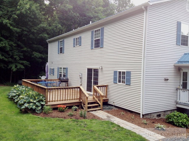 304 Green Knob Mountain Road Boone, NC 28607 - Photo 23 of 32 a view of a house with backyard and sitting area