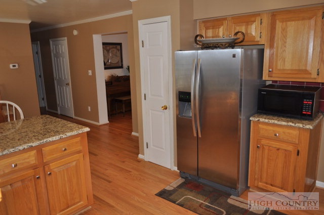 304 Green Knob Mountain Road Boone, NC 28607 - Photo 4 of 32 a kitchen with stainless steel appliances granite countertop a refrigerator and a stove