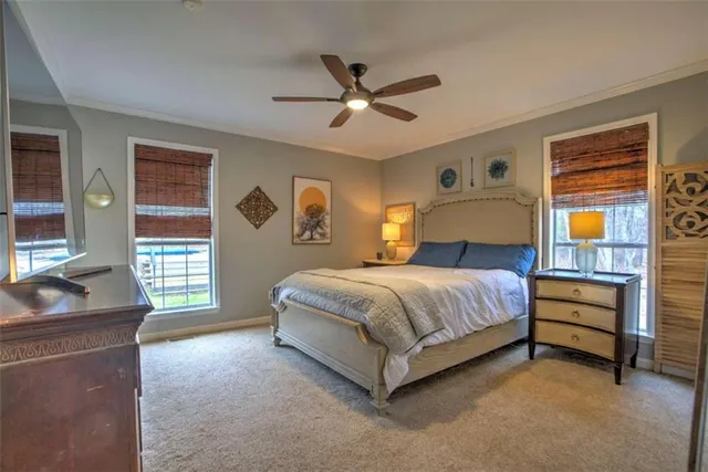 a spacious bedroom with a bed and a window
